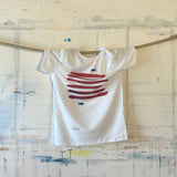 Sopra e sotto le righe La maglietta.